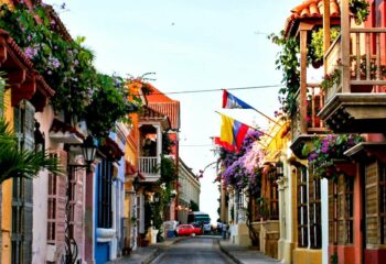 Walking down a colorful street in Cartagena on a tour of Colombia