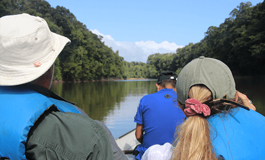 family on river boat and jungle tour in Guyana