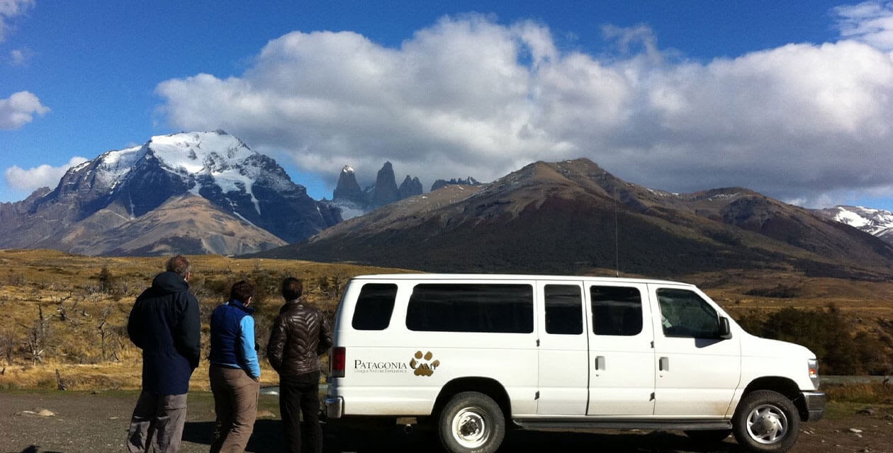 hikers exploring by rental car in patagonia